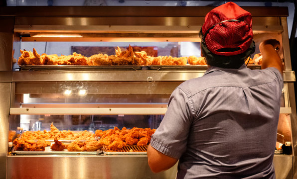 Minimum Wage Employee Works in a Fast Food Kitchen.