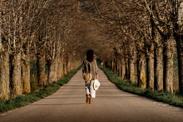 Back view of thoughtful woman walking