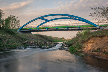 Fototapeta na wymiar Bridge over the Jeziorka river near Konstancin-Jeziorna, Masovia, Poland