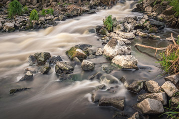 Water cascades on Jeziorka river near Konstancin-Jeziorna, Masovia, Poland.