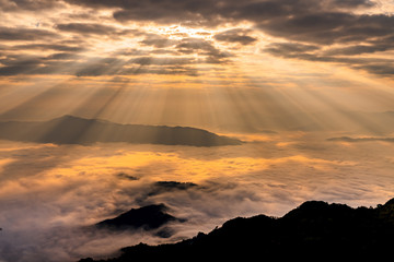 Sunrise with mist on hills 