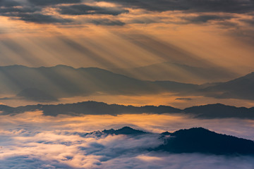Sunrise with mist on hills 