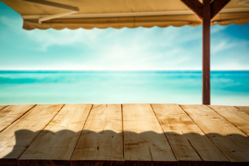Fototapeta premium Desk of free space and summer beach with umberlla 