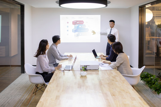 Business people having meeting in board room 