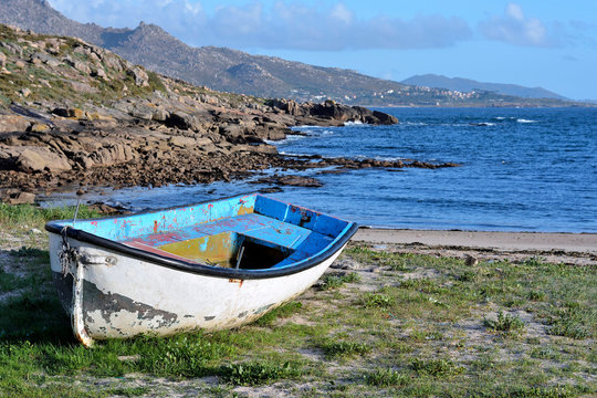 Abandoned traditional fishing rowboat in the Galician coast, Northern Spain