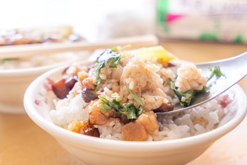 Braised pork over rice - Taiwan famous traditional street food delicacy. Soy-stewed pork on rice. Travel design concept. Top view,copy space,close up