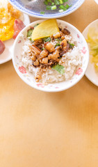 Braised pork over rice - Taiwan famous traditional street food delicacy. Soy-stewed pork on rice. Travel design concept. Top view,copy space,close up