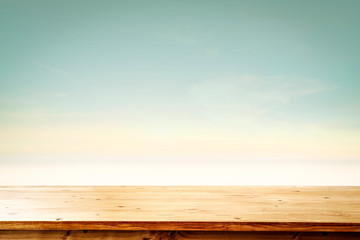 desk of free space and blurred background of beach. 