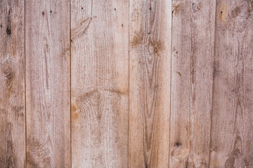 Closeup flatlay of wooden planks of rustic fence. Color photography of beautiful natural organic background.