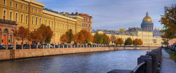 Panorama of the Moika river embankment and St. Isaac's Cathedral in St. Petersburg