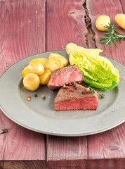 steak fried with salad and potato