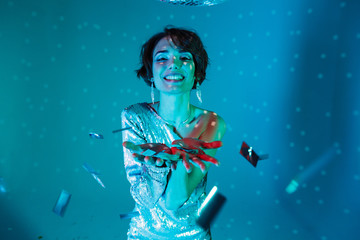 Cheerful beauty woman having fun and looking at the camera