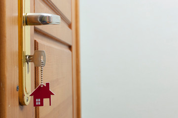 A key in a lock with house icon on it
