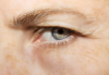 A beautiful insightful look eye. Close up shot. The eye of an elderly woman
