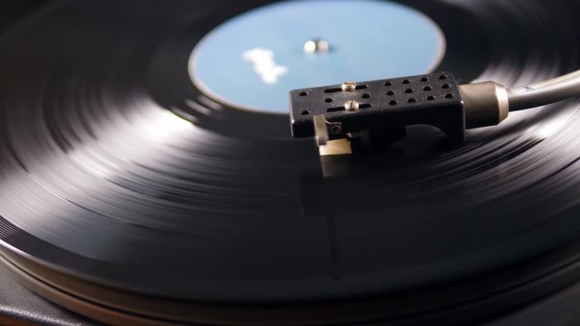 Cartridge of the vinyl player and the rotating record