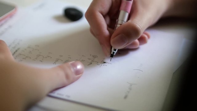 Young girl doing her homework after school
