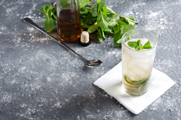 Fresh made delicious mint julep served on the grey bar table.Empty space for your text - obrazy, fototapety, plakaty