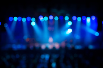 Fototapeta na wymiar Defocused entertainment concert lighting on stage