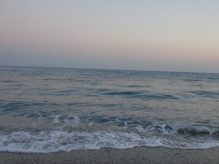 Genova, Italy - 04/22/2019: Close-up of big waves breaking on the coast in Liguria, Italy, Europe. White waves of the sea break on the cliff.