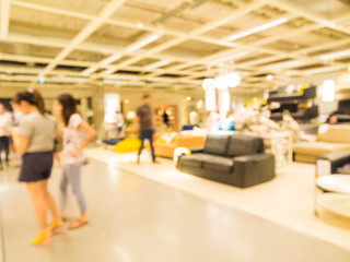 Abstract motion blurred people shopping in furniture store