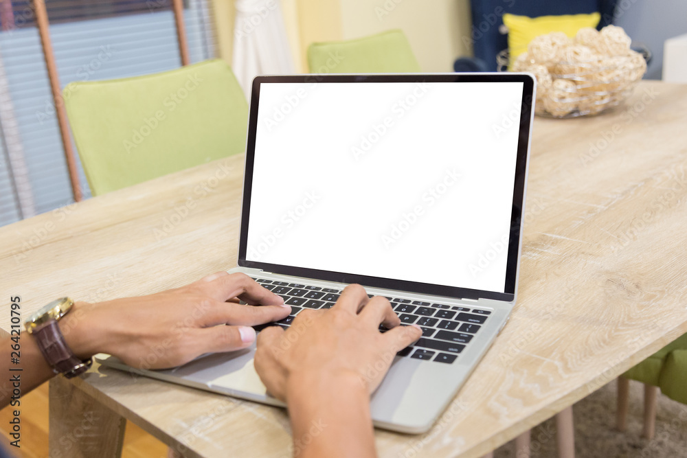 Sticker mockup image of a businessman using laptop with blank white desktop screen working in home- image