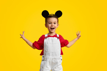 Excited child with mouse ears