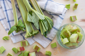 selection of forced rhubarb stalks on a wooden chopping board