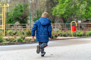 Small child running in a park