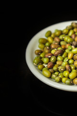 mung beans, mash. green beans in a white plate on the table. top food background. copy space