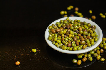 mung beans, mash. green beans in a white plate on the table. top food background. copy space