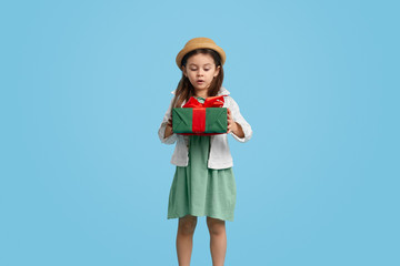 Surprised girl with present