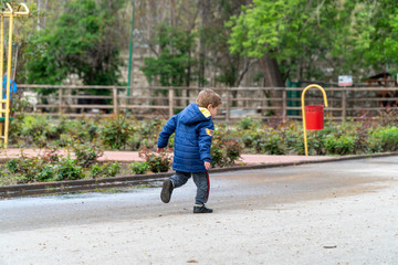 Small child running in a park