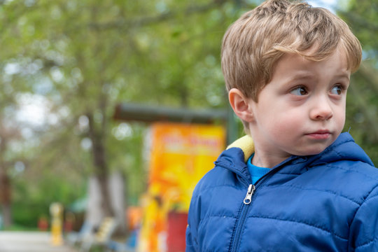 Small Child Looking Back Over The Shoulder