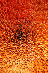 orange PVC pipes stacked in construction site