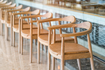 Row of wooden dining room chairs