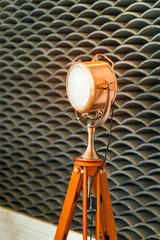 Elegant copper light lamp on wooden holder