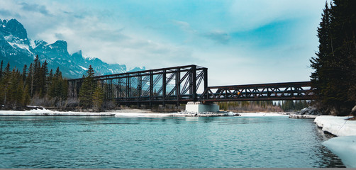 Historic Canmore Engine Bridge is a truss bridge over the Bow River in the Canadian Rockies of Alberta. The bridge was built by the Canadian Pacific Railway in 1891 to serve a coal mine.
