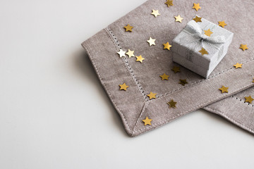 Gift box with silver ribbon bow isolated on white background.