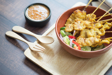 Pork satay, grilled pork served with peanut sauce or sweet and sour sauce.