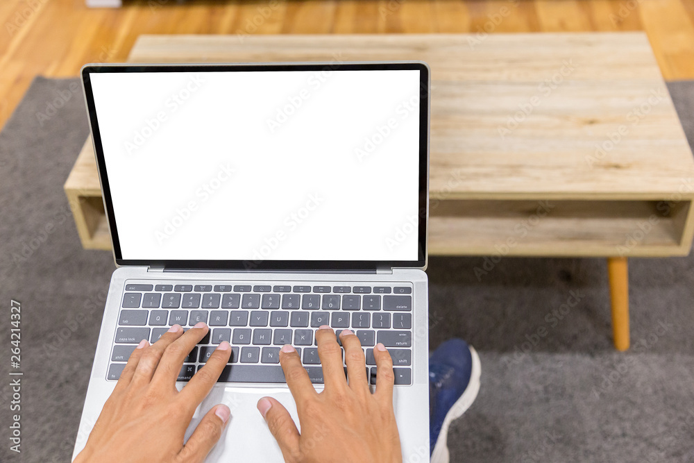 Sticker mockup image of a businessman using laptop with blank white desktop screen working in home- image