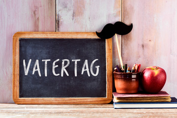 text fathers day in german in a chalkboard