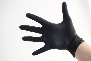 Women hand in black gloves nitril