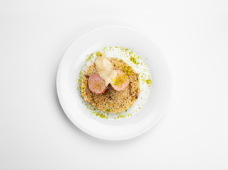 Duck, risotto, ginger, and pistachio, forest fruit sauce.
