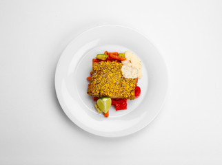 Shallow filet, corn flakes and seed mix, baked vegetables, lemon sauce and mint.