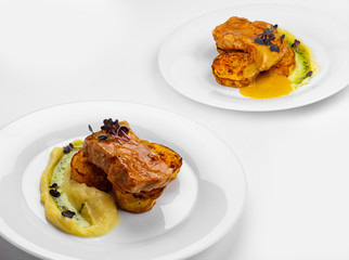 Pork chops, sous-vide cooking, baked potatoes, parsley cream, apple sauce. 