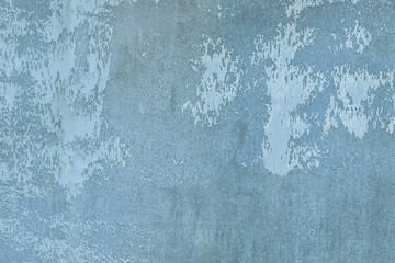 Uneven texture, with stains and smudges. Old wall painted dirty blue. Empty abstract background for layouts.