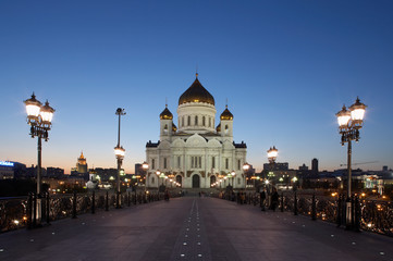 Fototapeta na wymiar CATHEDRAL OF CHRIST THE SAVIOUR FROM RIVER BRIDGE AT TWILIGHT MOSCOW RUSSIA