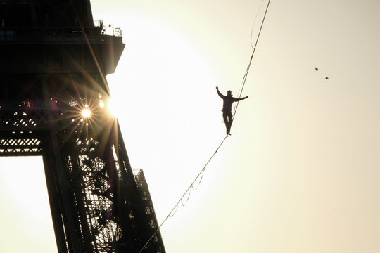 a man walk on a highline between Eiffel tower and Trocadero, &Icirc;le de France, Paris, France
