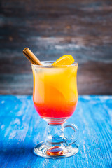Orange cocktail with spices. Selective focus. Shallow depth of field.