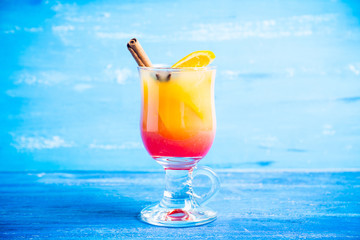 Orange cocktail with spices. Selective focus. Shallow depth of field.